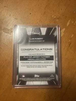 Luis Robert baseball card featuring jersey number medallion commemorative relics in 2022 Topps Series 1