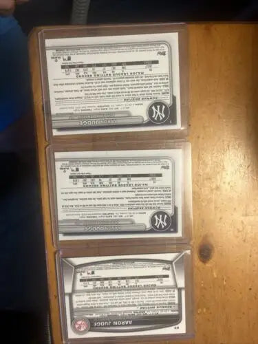 Three encased baseball cards from Bowman Aaron Judge lot showcasing Chrome and Base designs