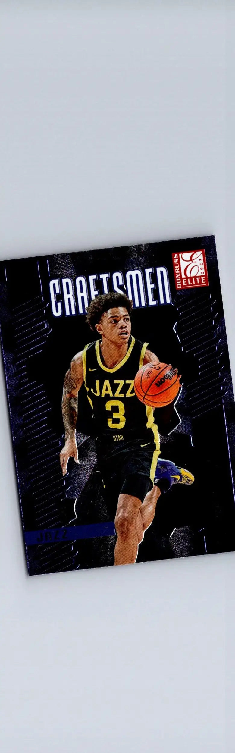 Basketball trading card featuring Keyonte George in a black and yellow Jazz jersey dribbling the ball