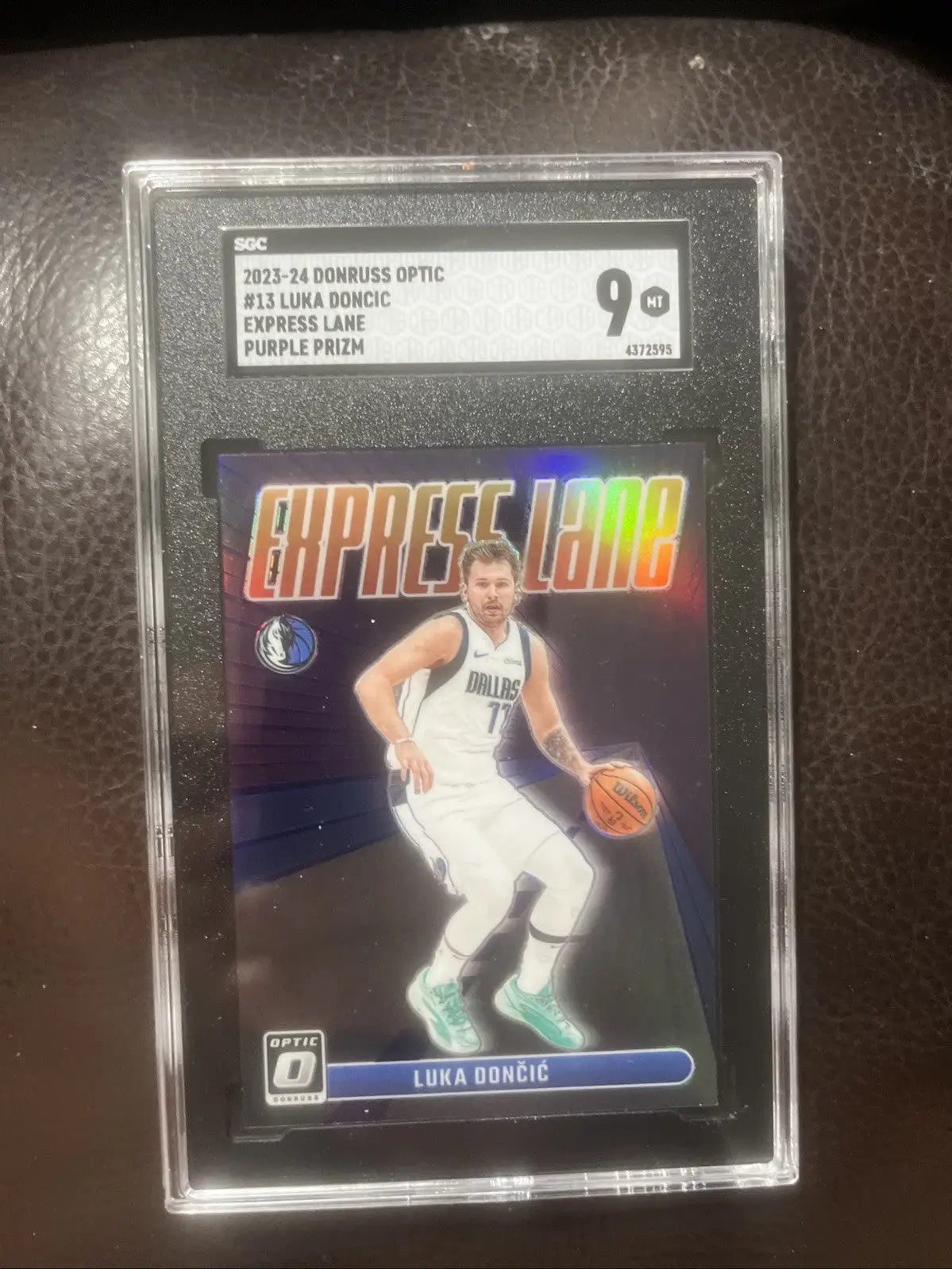 Graded Luka Dončić trading card from 2023-24 Panini Donruss Optic Express Lane Purple Prizm