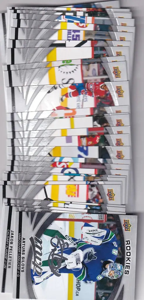 Stack of hockey trading cards from 2023-24 Upper Deck Silver Script Subset collection