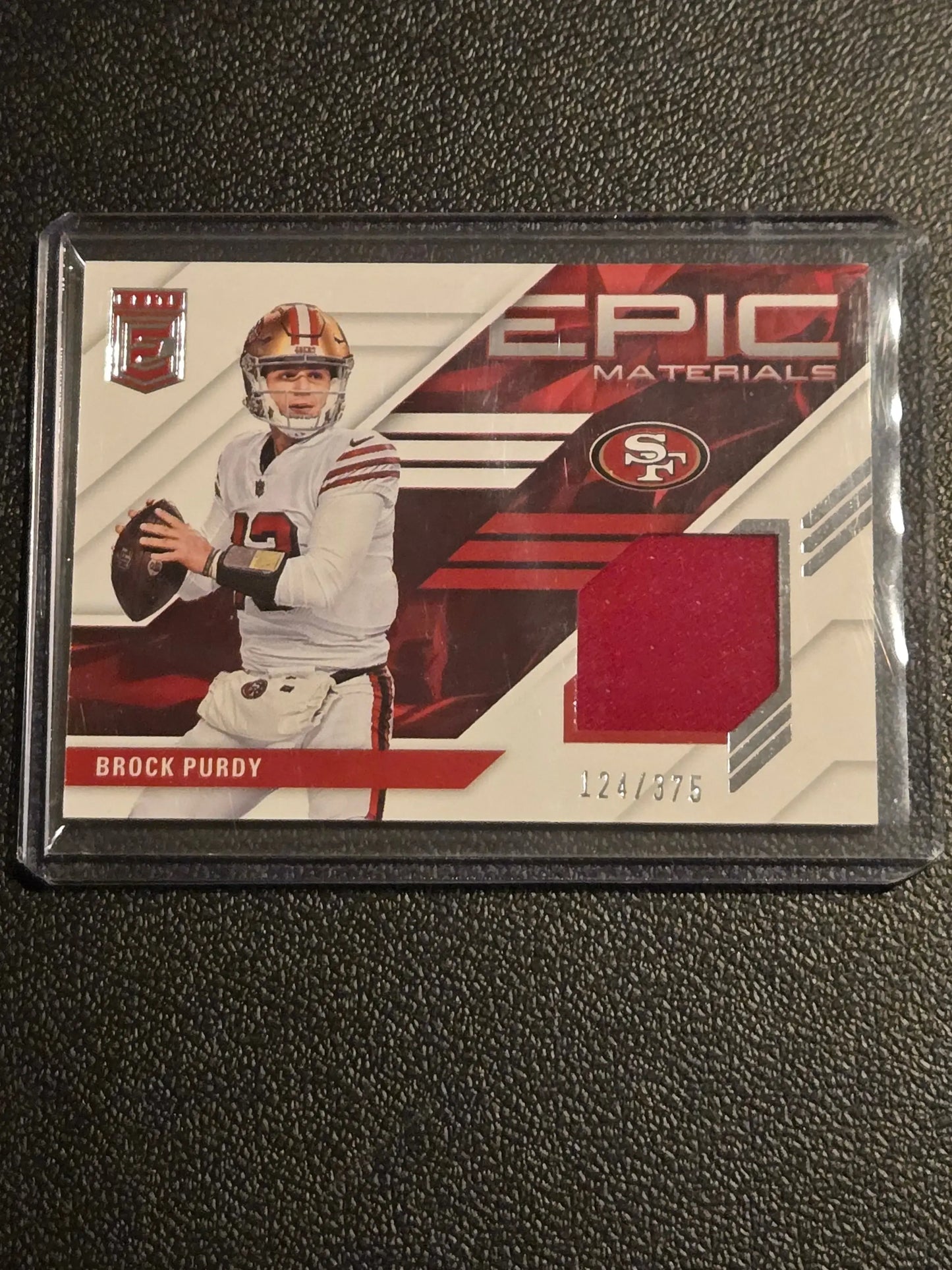 2023 Donruss Elite #4 Brock Purdy Epic Materials #/375 - Football Card Single