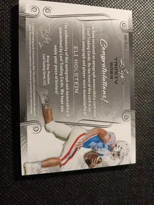 2023 Leaf Trinity - Patch Auto Eli Holstein #PA-EH1/99. NRMT+ - Football Card Single
