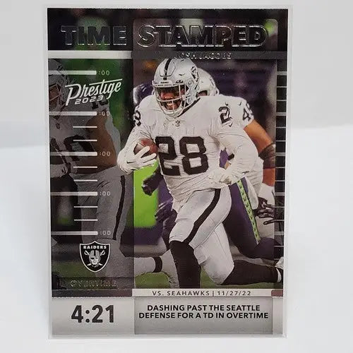 Collectible Panini Prestige Josh Jacobs football card featuring Raiders player in white and black uniform