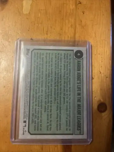Baseball card in protective case for 2023 Topps Heritage Aaron Judge Tribute MVP trading card