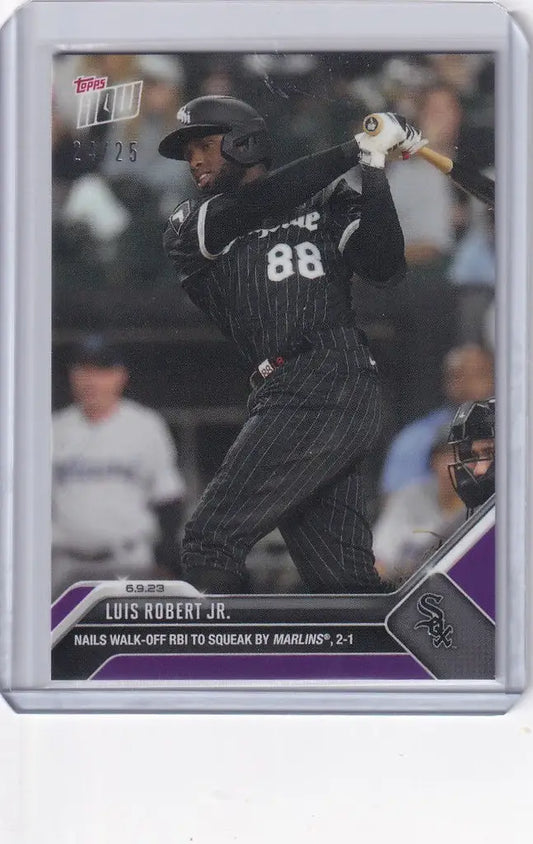 Baseball card of Luis Robert Jr in dark uniform, swinging bat for Chicago White Sox
