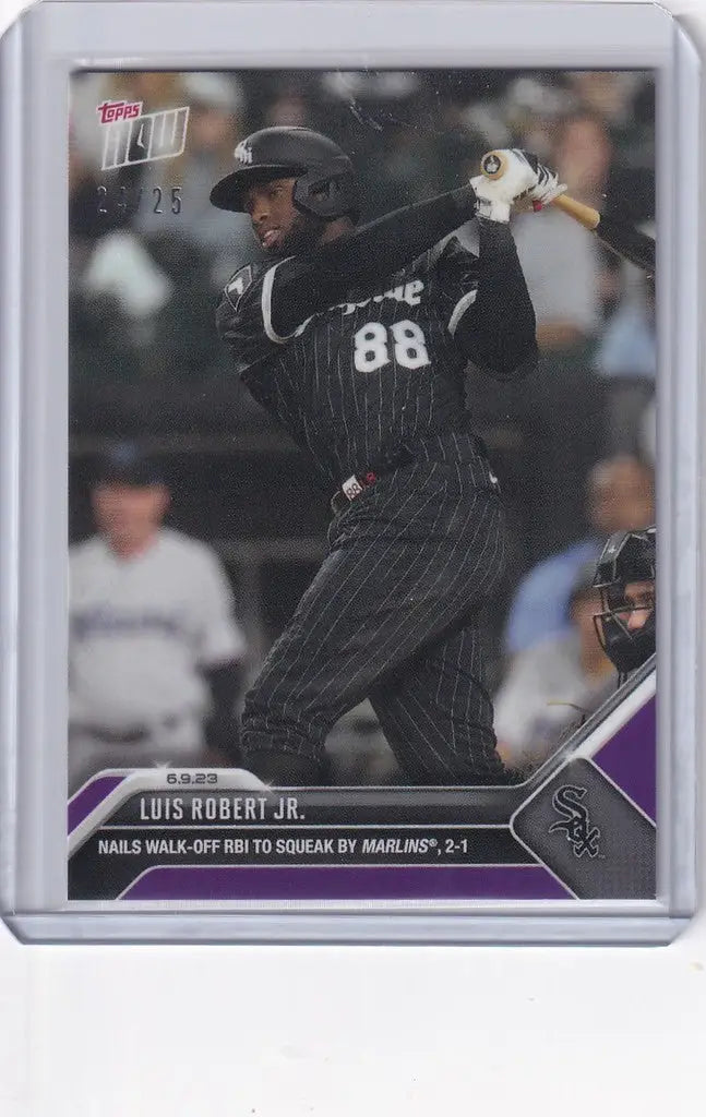 Baseball card of Luis Robert Jr in dark uniform, swinging bat for Chicago White Sox