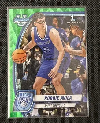 Green shimmer basketball trading card of Robbie Avila in blue uniform dribbling