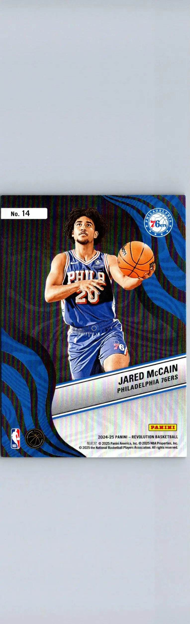 Basketball trading card featuring Jared McCain in blue uniform from Panini Revolution 2024