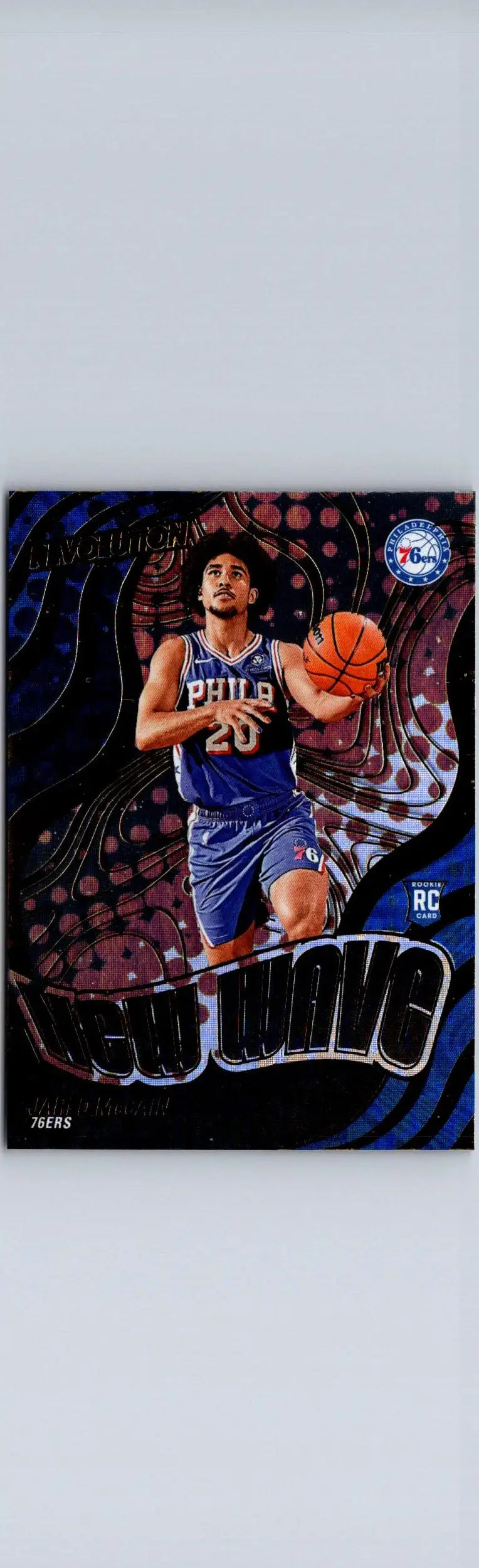 Basketball trading card featuring Jared McCain in a blue jersey from Panini Revolution 2024