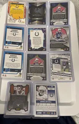 Assortment of football trading cards featuring Adonai Mitchell and memorabilia for 2024