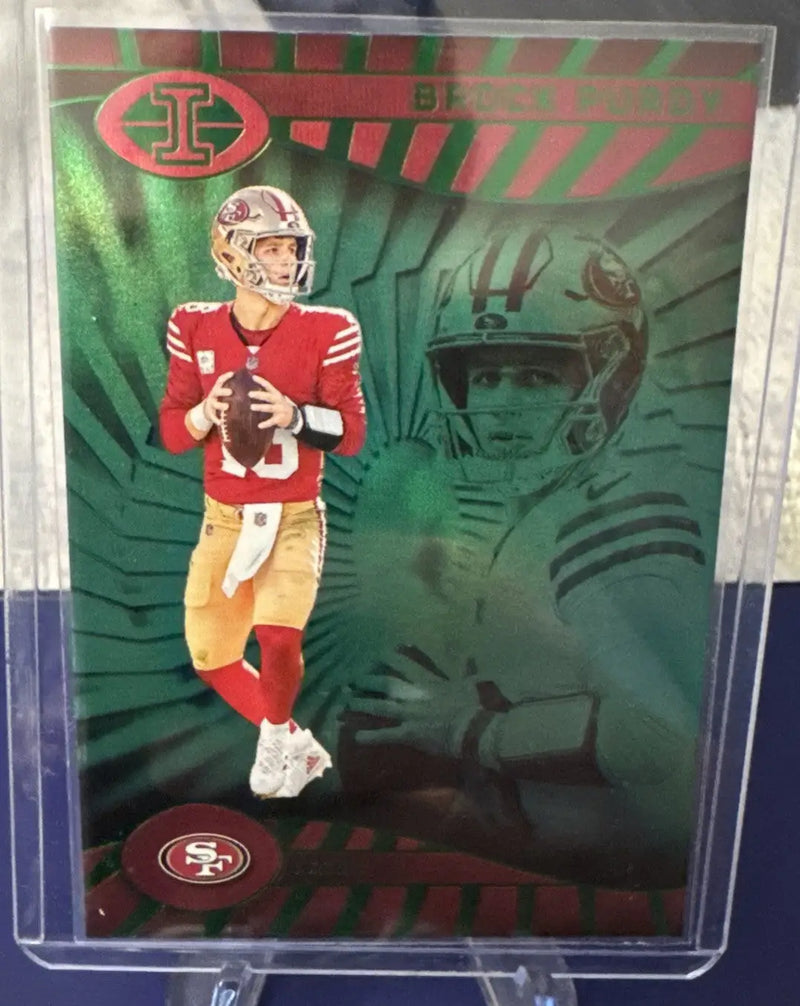 Football trading card featuring 49ers player in red jersey with illusions emerald green background