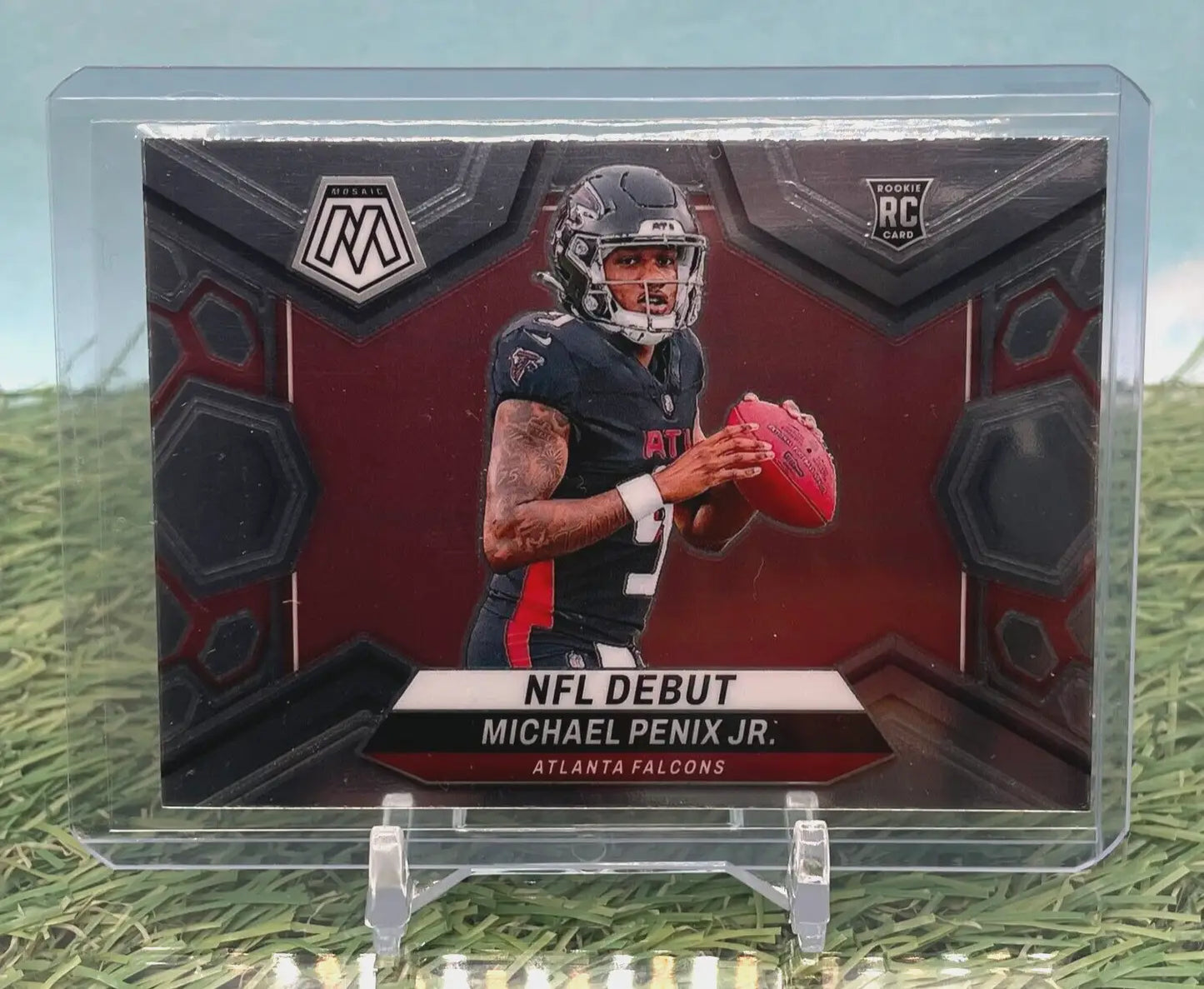 Football trading card of Michael Penix in black Falcons uniform with red football