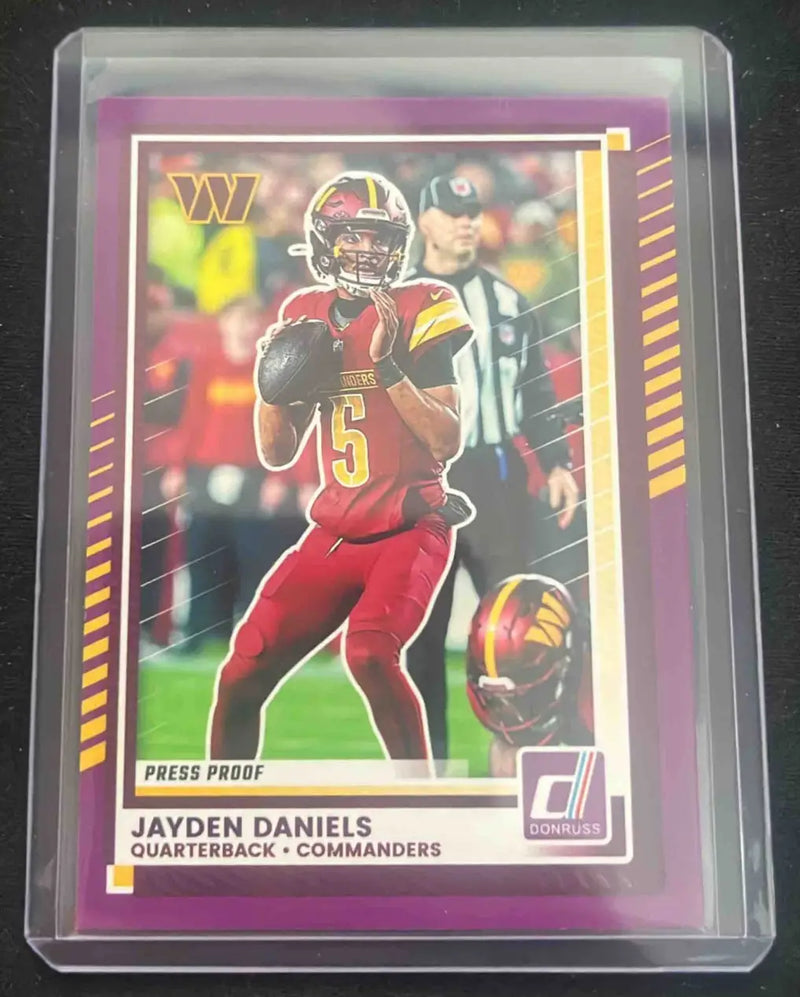 Panini Donruss Jayden Daniels football trading card in protective sleeve, Maroon Press Proof