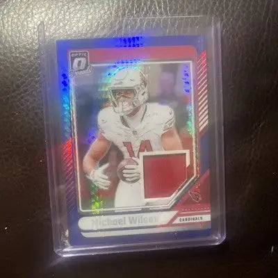 Michael Wilson football trading card from 2024 Panini Donruss Optic Threads Patch Blue