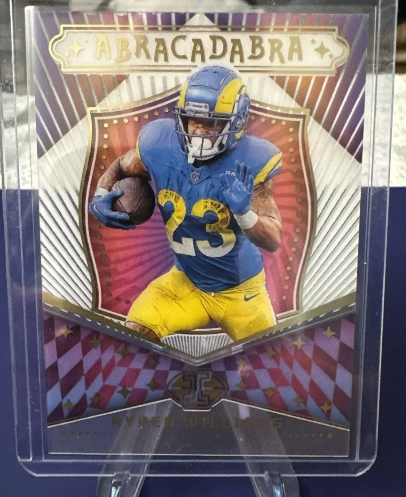 Collectible Panini Illusions Kyren Williams football trading card with player in blue and yellow uniform