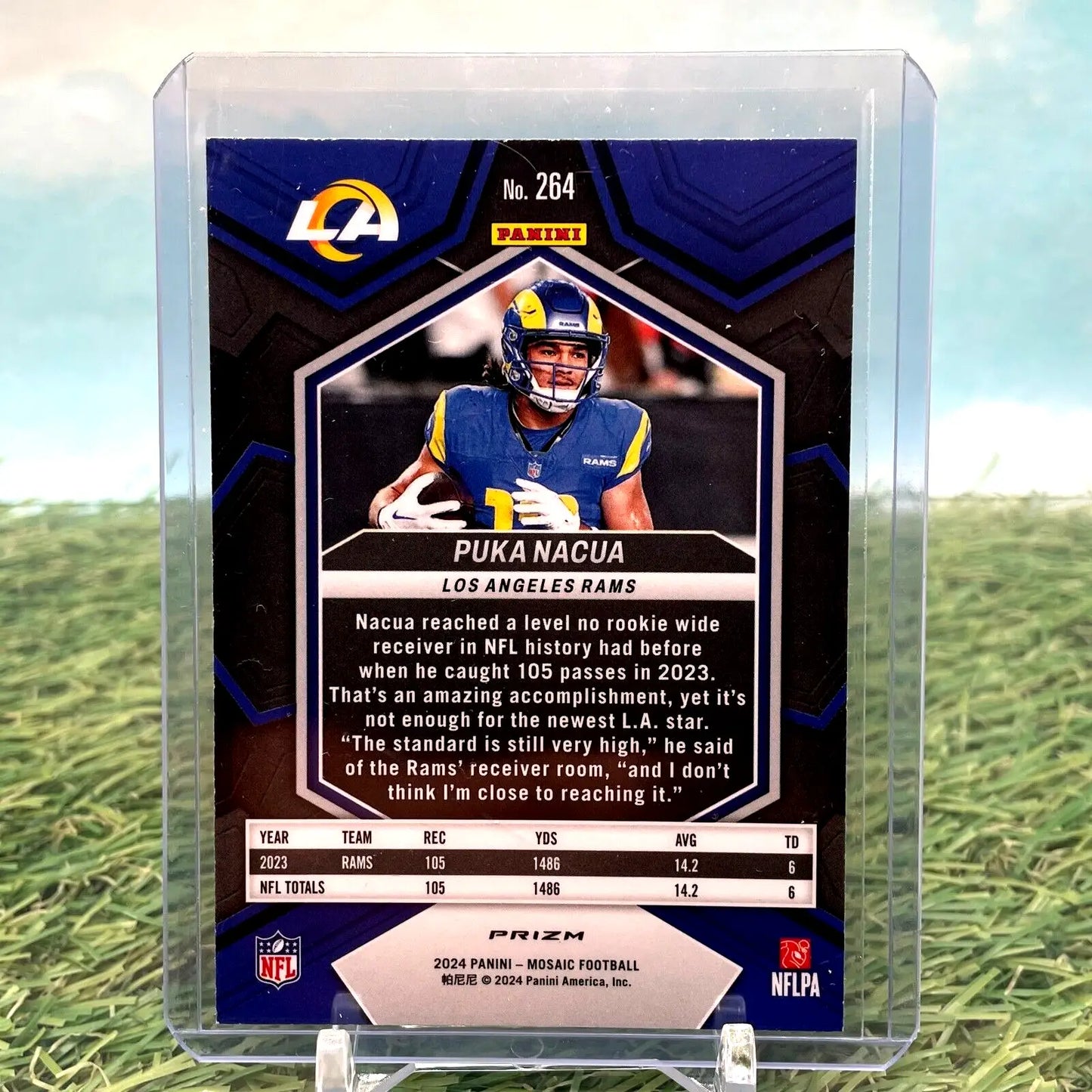 NFL trading card of Puka Nacua in a Los Angeles Rams uniform, Green Mosaic Prizm