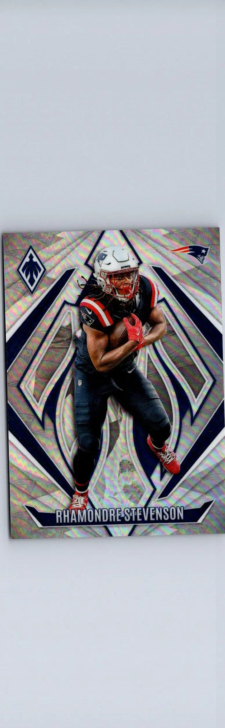Rhamondre Stevenson football card featuring team logos from 2024 Panini Phoenix #124