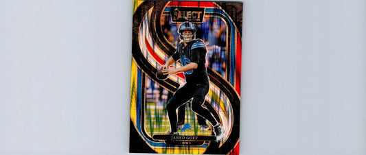 Football trading card of Jared Goff in black uniform with red and yellow Prizm Shock