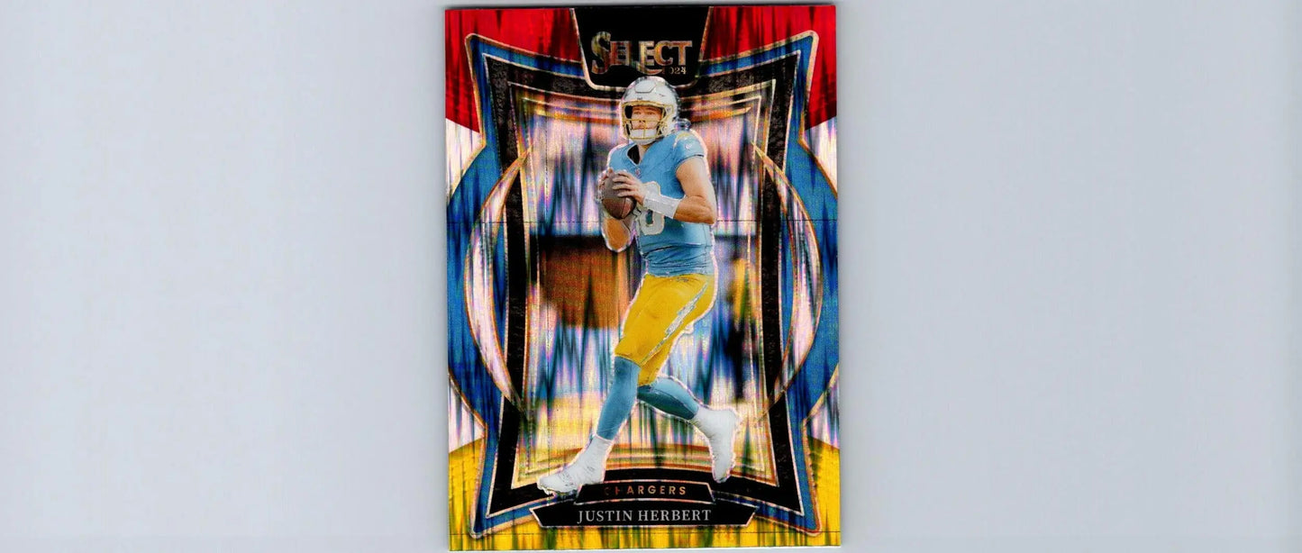 2022 Select Justin Herbert football trading card featuring Red & Yellow Prizm Shock design