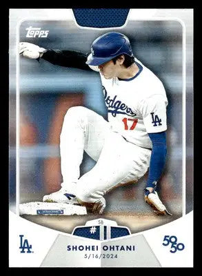 Shohei Ohtani Topps baseball trading card showing him sliding into a base in 2024 Topps 50/50