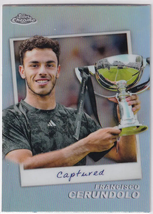 Tennis player holding reflective silver trophy from Topps Chrome Captured #CTD-FC