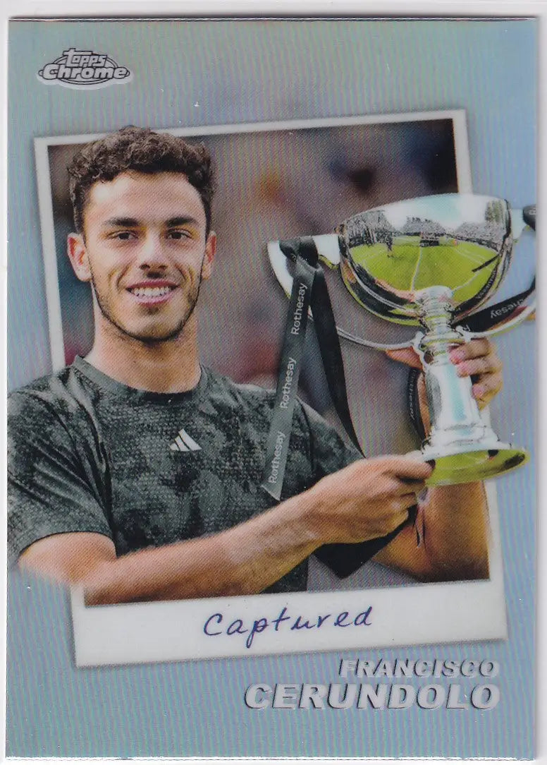 Tennis player holding reflective silver trophy from Topps Chrome Captured #CTD-FC