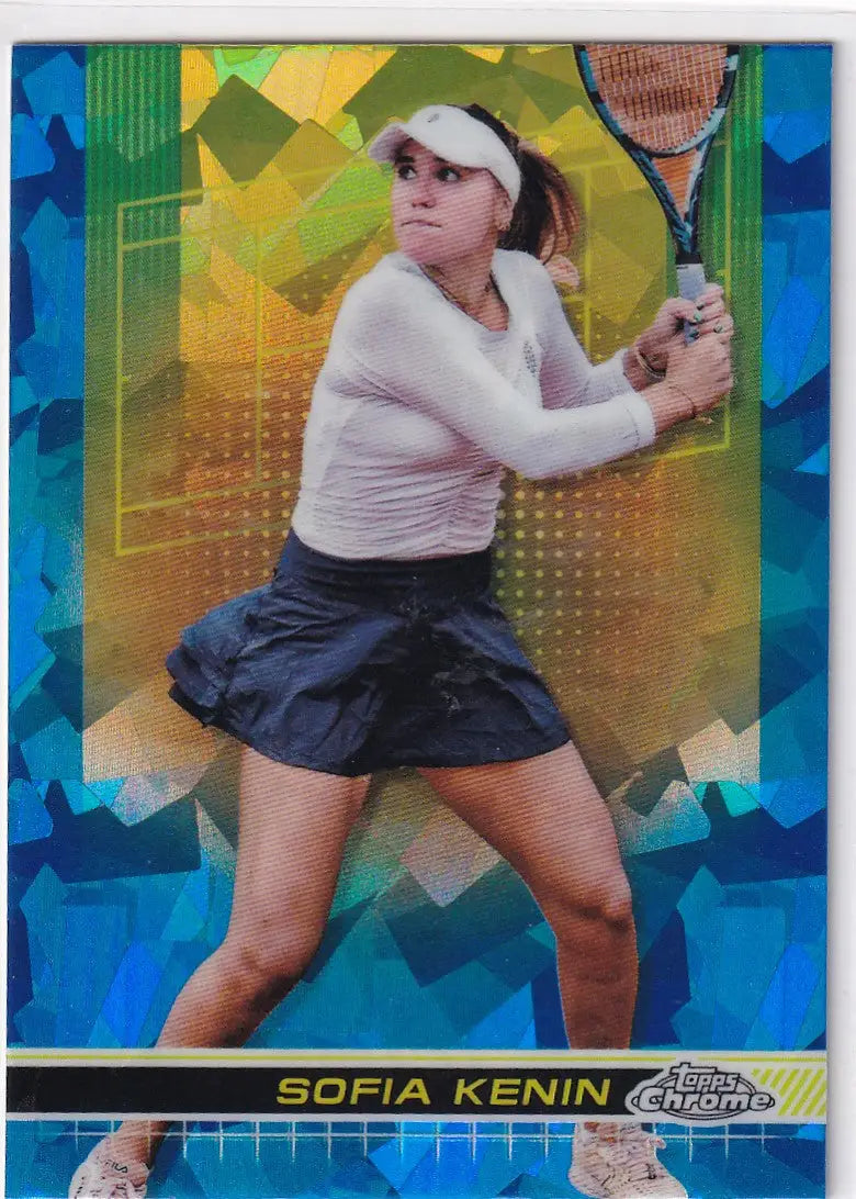 Tennis player in white top and navy skirt ready to hit backhand in Topps Chrome Sapphire card