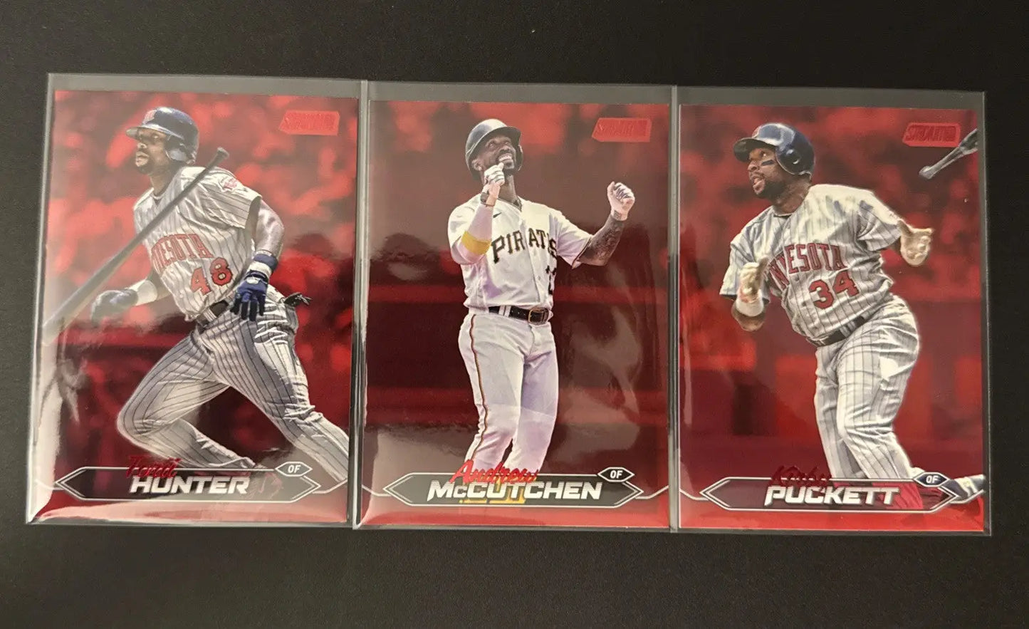 2024 Topps Stadium Club baseball trading cards featuring Torii Hunter, Andrew McCutchen, and Kirby Puckett with red foil background