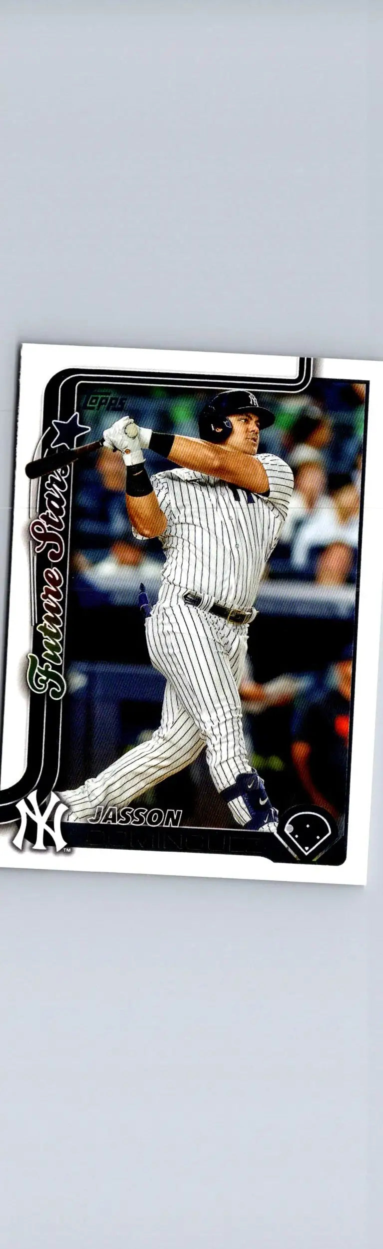 Baseball trading card of Jasson Domínguez swinging bat in Yankees pinstripe uniform