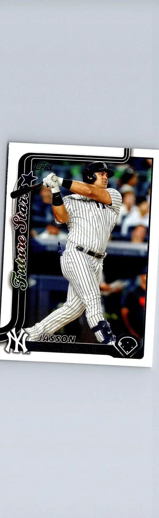 Baseball trading card of Jasson Domínguez swinging bat in Yankees pinstripe uniform