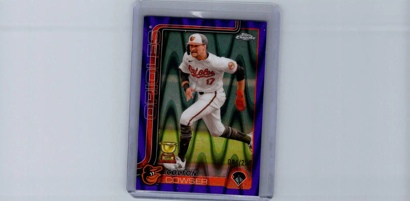 Colton Cowser purple refractors baseball trading card in protective holder featuring running player