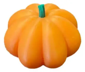 Bright orange printed pumpkin-shaped candle with green stem wick for cozy autumn decor