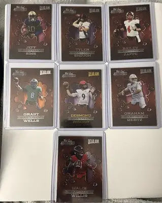 Seven Wild Card Alumination NIL football trading cards in protective sleeves for collectors