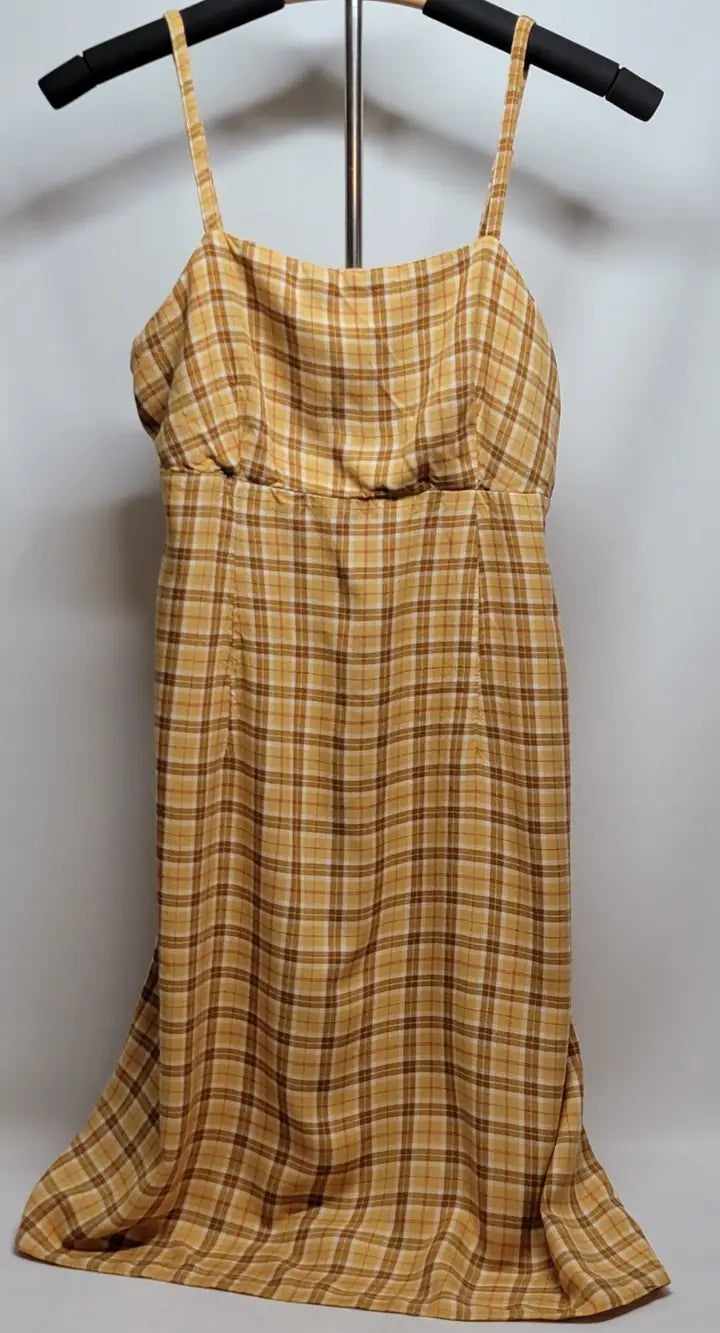 Sleeveless 90s yellow plaid mini dress with spaghetti straps and knee-length fit