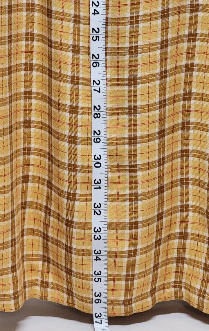 Yellow plaid mini dress fabric with measuring tape, perfect for 90s yellow plaid style