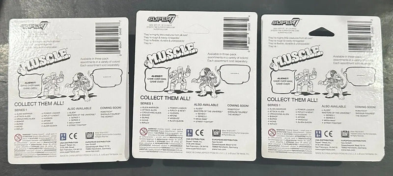Three MUSCLE toy packaging cards from Aliens Super7 M.U.S.C.L.E. Sets collectible trading cards