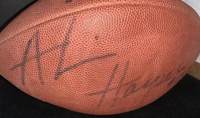 Autographed brown leather Dallas Cowboys football signed by Alvin Harper with JSA COA