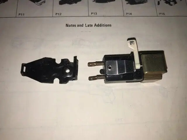 Black electrical switch with mounting bracket for Arista 2303 CN-62, ideal for trading cards
