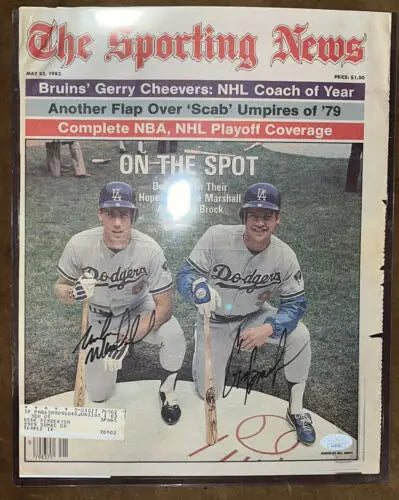 Framed autographed Sporting News magazine featuring Greg Brock and Mike Marshall of Los Angeles Dodgers
