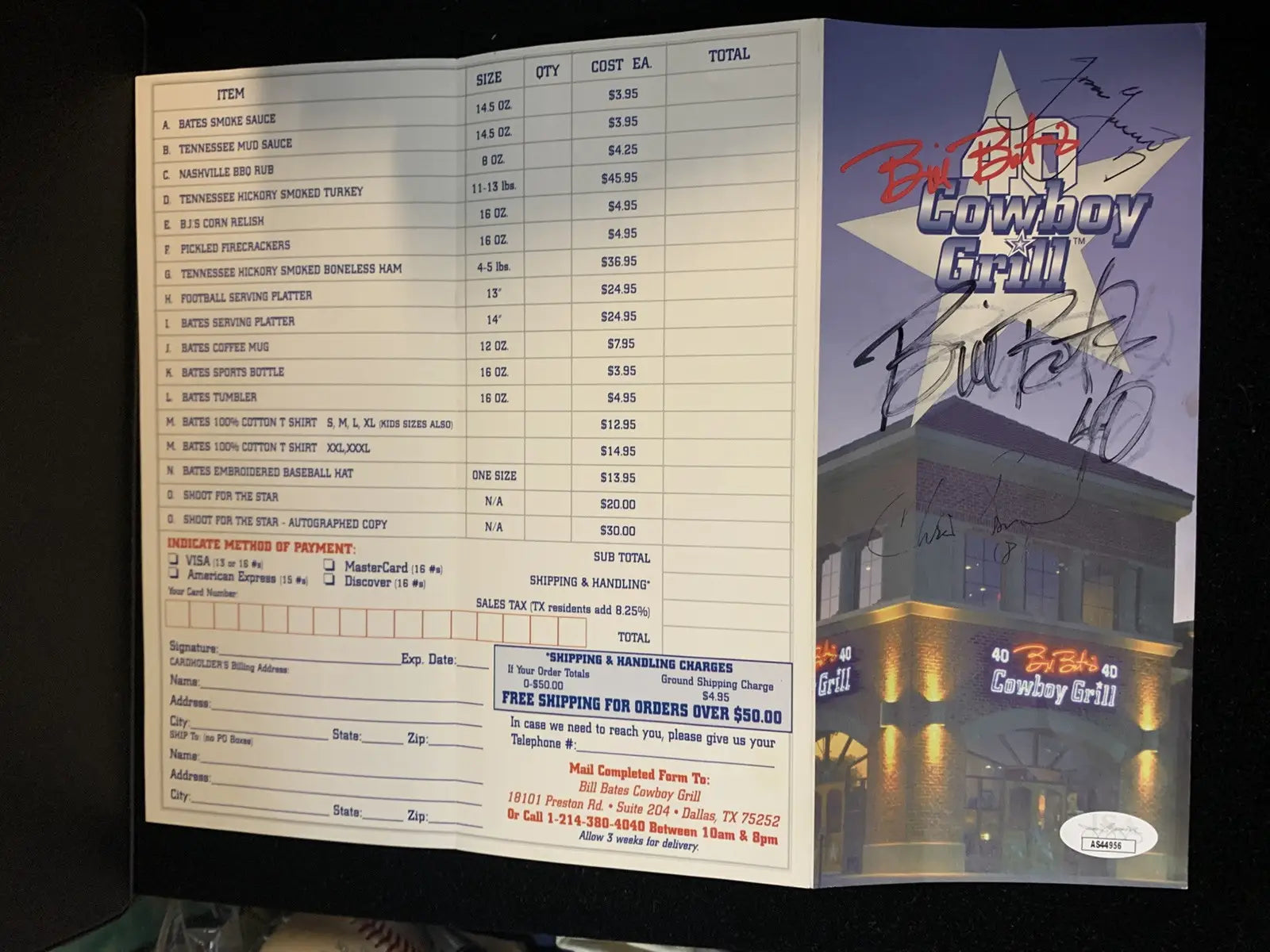 Autographed Cowboy Grill menu featuring Jason Garrett and Chris Bonoil signatures