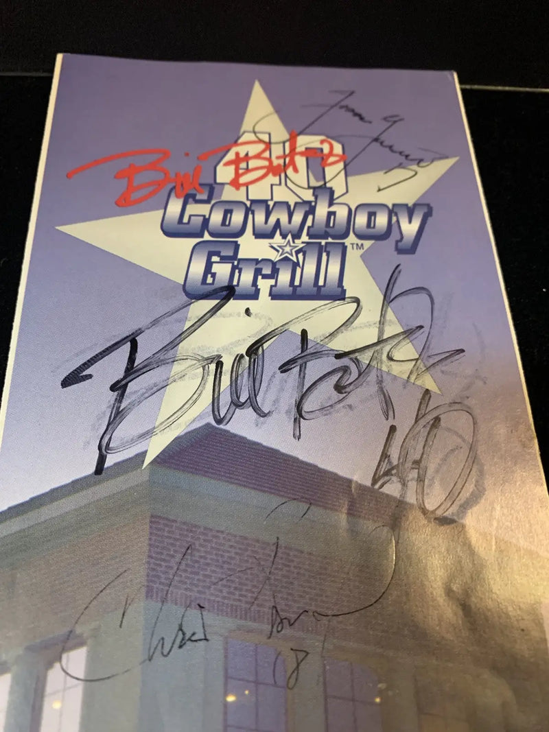 Signed Cowboy Grill poster featuring Jason Garrett and Chris Bonoil on the grill menu