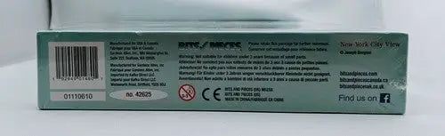 Toy packaging with warnings and manufacturer info for Bits and Pieces New York City View 300 Piece Jigsaw Puzzle
