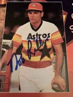Autographed baseball player photo from Houston Astros souvenir program scorebook featuring Nolan Ryan