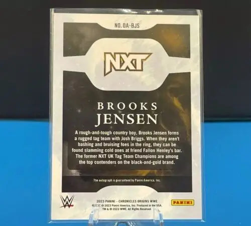 Brooks Jensen Origins Red Autograph from 2023 Panini WWE Chronicles wrestling card