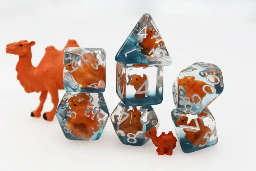 Clear resin Caravan Camel RPG Dice Set with embedded orange camel figures for camel RPG dice