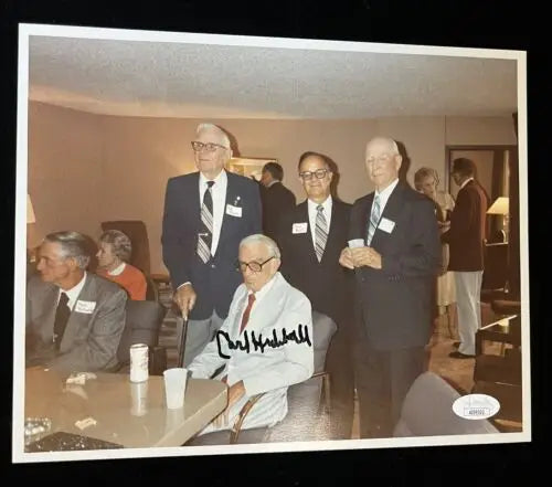 Autographed 8x10 photo of Carl Hubbell with Pat Olsen and Paul Richards in suits