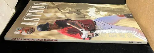 Carlos Lee signed Houston Astros game magazine featuring Biggio’s autograph