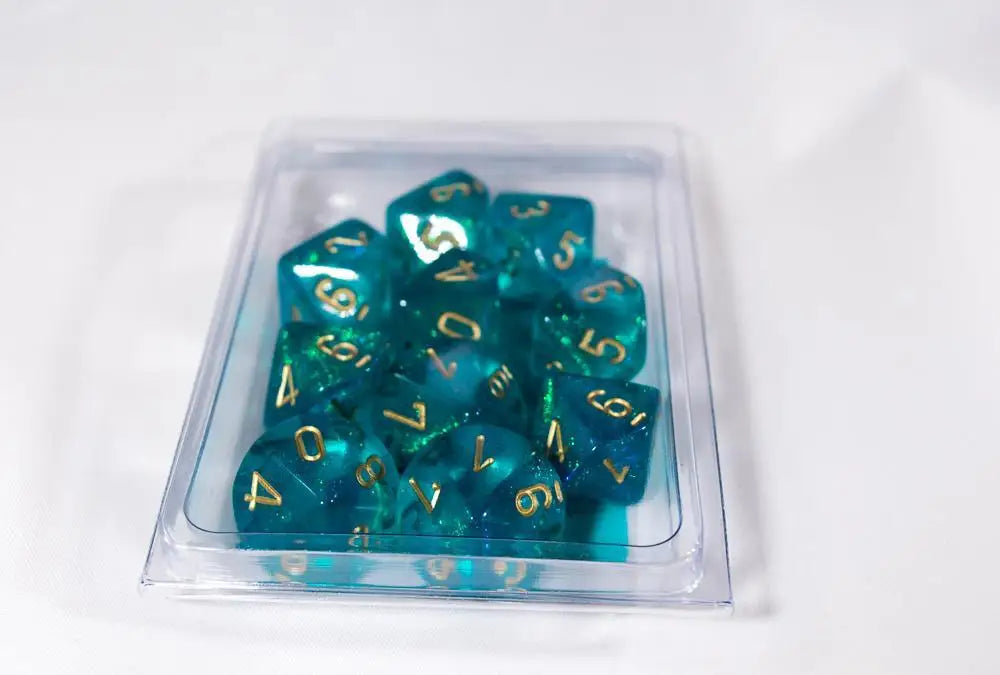 Translucent teal Chessex D10 dice set with gold numbering for tabletop gaming