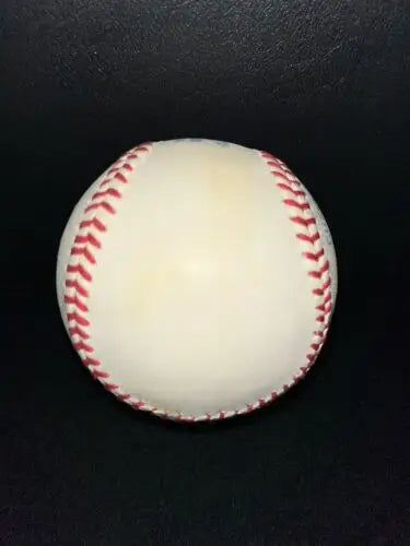 Worn MLB baseball with red stitching, signed by Chi-Chi Rodriguez for golf collectors